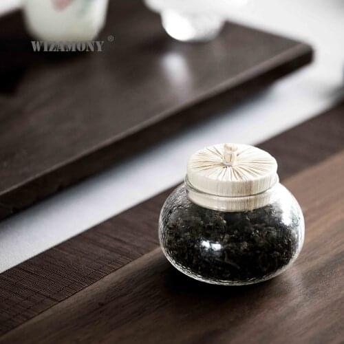 Sealed cup of tea stored in sealed cup of coffee beans