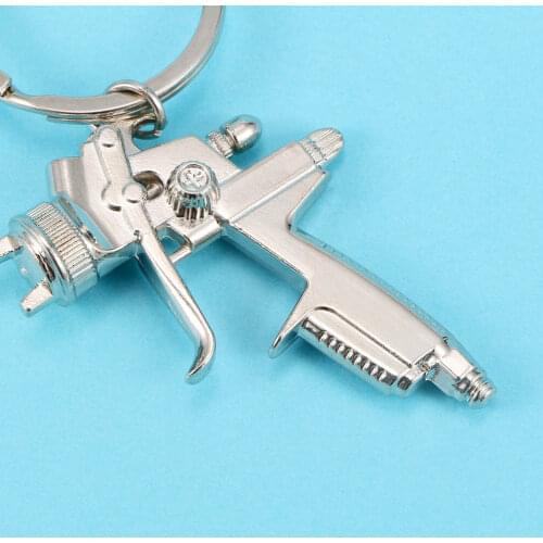 1pcs Creative Metal Water Gun Keychain Novelty Water Spray Gun Key Chain Small Pendant Novelty keychain Handbags Accessories
