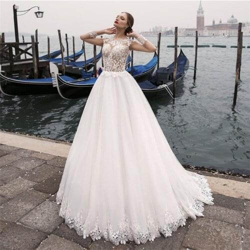 Sheer Scoop Long Sleeves A-Line Wedding Dresses Lace Appliques With Buttons Back Bridal Gowns Women Vestidos De Mariage