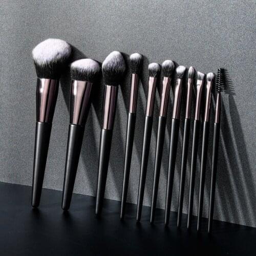 11 makeup brushes with black and white double foundation for eye makeup