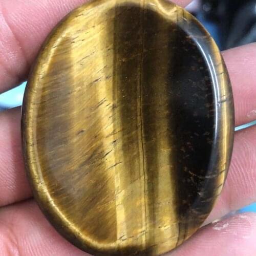 Natural tigers eye stone carving thumb button crystal quartz, used for processing Reiki treatment