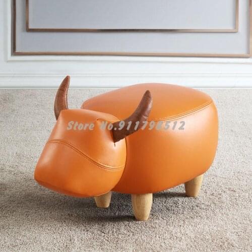 Cow shoe stool household solid wood leather creative small stool sofa stool door shoe stool animal footstool low stool