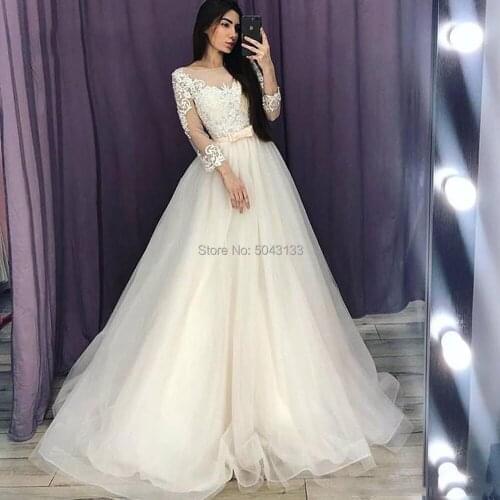 Light Champagne Wedding Dresses 2020 Lace Applique Scoop Neck Long Sleeve Soft Tulle Bridal Gown with Bow Long Train Bride Dress