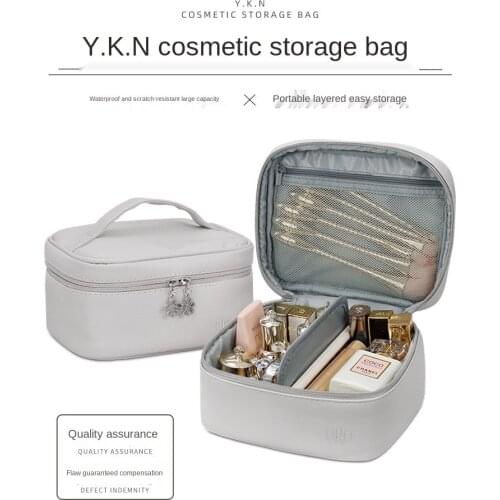 Cosmetic bag 2020 new super fire super capacity female portable cosmetic storage bag cosmetic bag high sense of simplicity