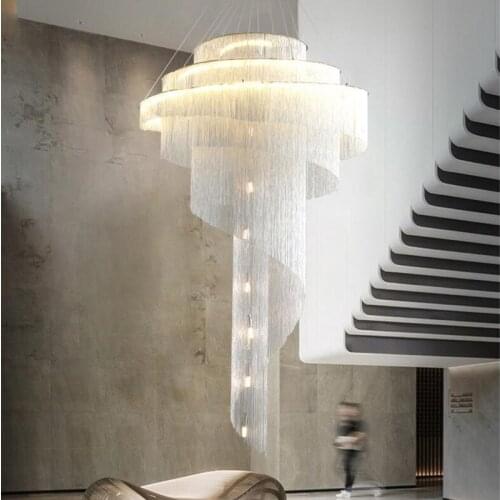 Post-modern duplex building large chandelier empty living room villa golden tassel spiral staircase light