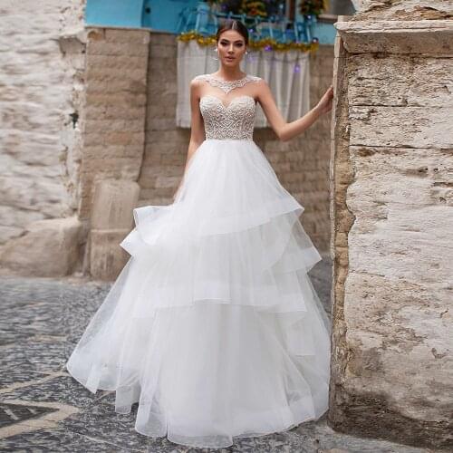 Luxury Beading Wedding Dresses Sexy O Neck Sleeveless Tiered Tulle A Line Bridal Gown Sweep Train Robe De Mariee