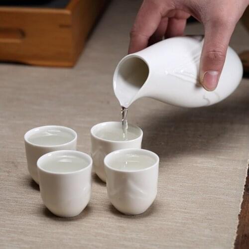 Japanese relief ceramic sake set wine pot cup Chinese baijiu home restaurant wine dispenser white rice wine wineware