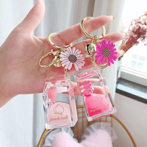 2021 Creative Cute Daisy Fruit Milk Bottle Keychain Floating Moving Liquid Quicksand Drift Bottle Keyring For Women Bag Pendant