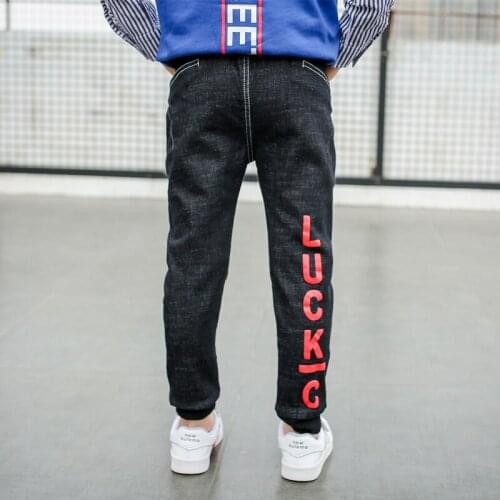 Boys plus velvet jeans childrens pants boys autumn and winter new big childrens letters trousers tide