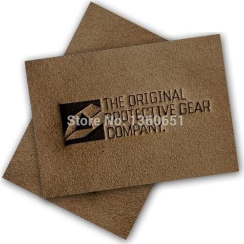 Leather label factory help you custom made your own logo leather labels for clothing