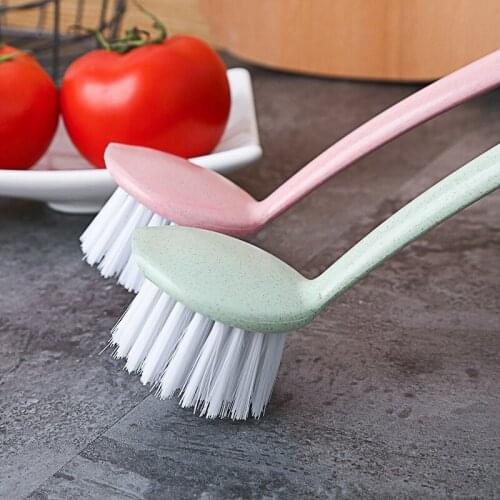 A brush with a long handle, a brush, a small brush, and a kitchen utensil for washing dishes