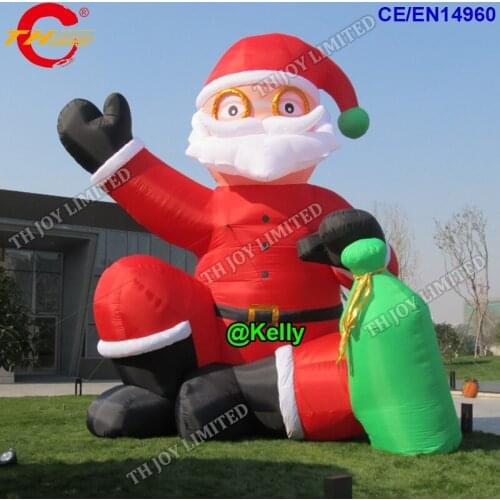 Free door shipping giant inflatable Santa Claus sitting on ground sending out gifts,advertising inflatable cartoons