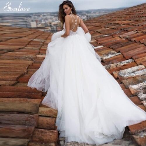 EVALOVE Luxury Spaghetti Straps Beading Pearls Bride A-Line Wedding Dress Romantic Sweetheart Neck Backless Bohemian Bridal Gown