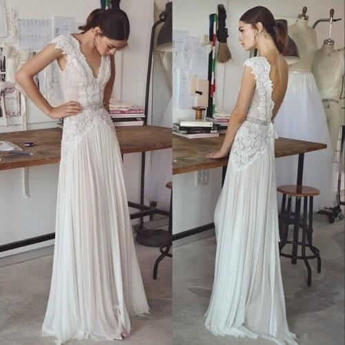 Wedding Dresses 2020 Bohemian Wedding Gowns with Cap Sleeves V Neck Open Back Pleated Skirt Elegant A line Bridal