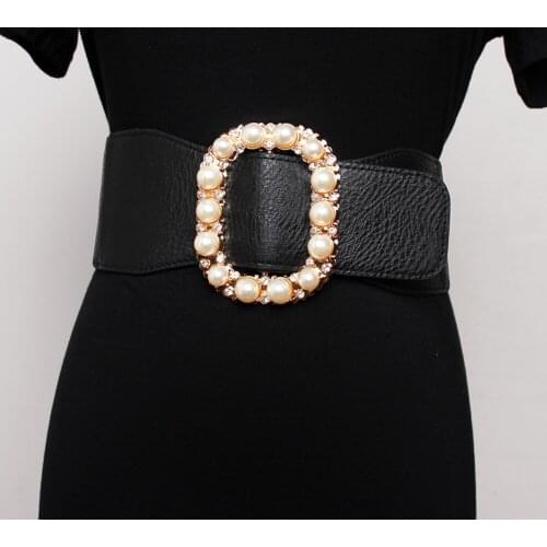 Temperamental style is set with diamond pearl elastic wide girdle skirt to match coat seal girdle outside