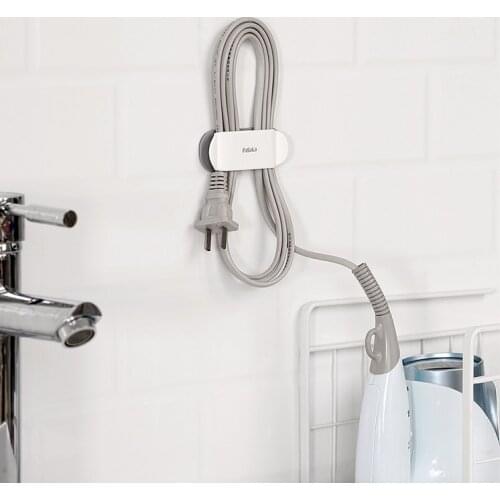 Wall Storage Organization Hook Power Plug Rack Socket Clip Holder Home Wall Mounted Self Adhesive Mobile Phone Charging Stand