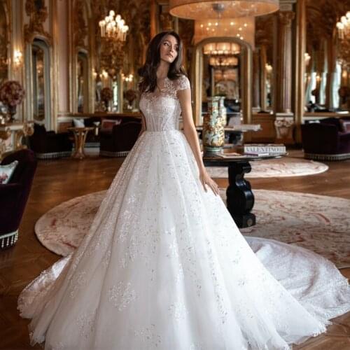 Princess Ball Gown Wedding Dresses Plus Size Trajes De Novia Cap Sleeve Buttons Up See Through Illusion Appliques Dress
