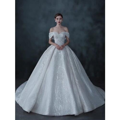 Luxury Beaded Wedding Dresses Off Shoulder Shiny Lace Pearls Crystal Court Train Ball Gown Princess Bridal Gowns Boat Neck New