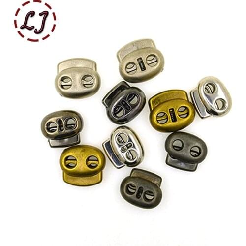 High quality 30pcs/lot silver bronze Nylon Double Holes Plastic Spring Cord Locks Stoppers Toggles plastic Buttons Free Shipping