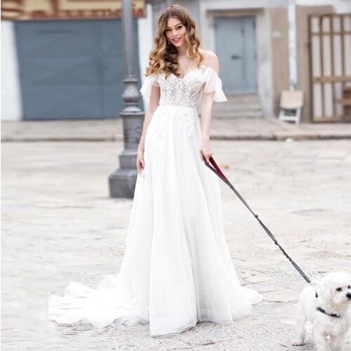 Charming Princess Wedding Dresses Spaghetti Straps A-Line Lace Appliques Ruched Backless Cheap Tulle Bridal Gown Sweep Train