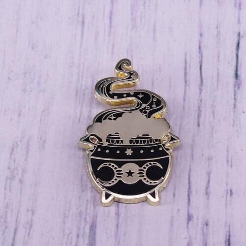 Brew up some black magic with this spooky cauldron pin! Attach to your fave clothing or bags