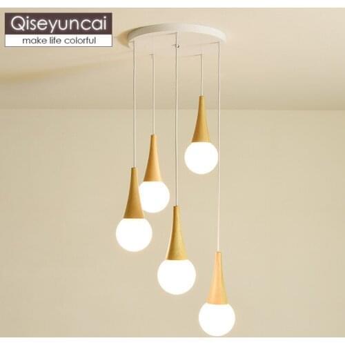 Qiseyuncai Nordic log three-head combination restaurant chandelier modern minimalist bar glass ball magic bean lighting