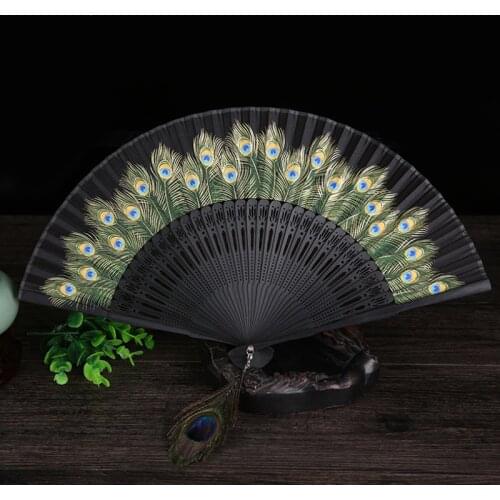 Ladies decorative folding fan Bamboo wood silk peacock hand crank fan Classical Chinese fan Outdoor holiday gift folding fan