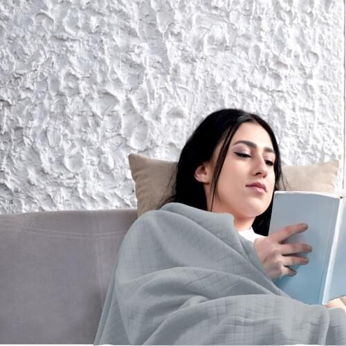 Ephemeris Fleece Blankets On The Sofa