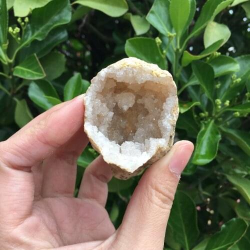 Natural agate geode crystal hole Mineral specimen contains clean crystal clusters of very beautiful small stones and crystals