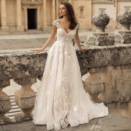 2021 Flower Appliqued Wedding Dress Elegant Cap Sleeve V Neck Sweep Train Bride Dresses Backless A Line Bridal Gown