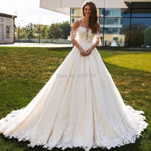 Luxury Wedding Dresses with Beadings 2021 Sexy Spaghetti Straps Ruffle Sleeves Sweetheart Ball Gown Wedding Bridal Gowns