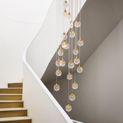 Postmodern light luxury staircase long chandelier simple personality villa duplex building restaurant atmospheric crystal lamp