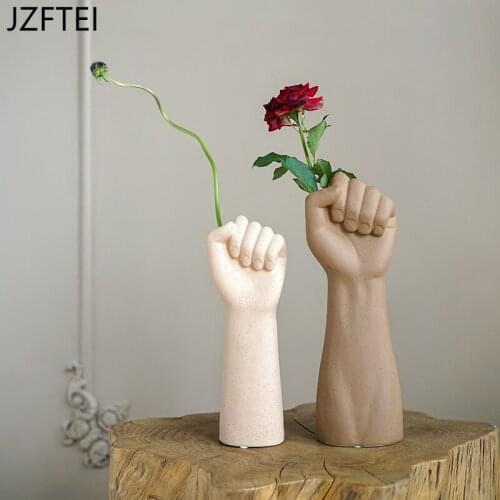 Creative Fist in Nordic style art in the form of hand accessories for decorating the flower house in ceramic ornaments for vases