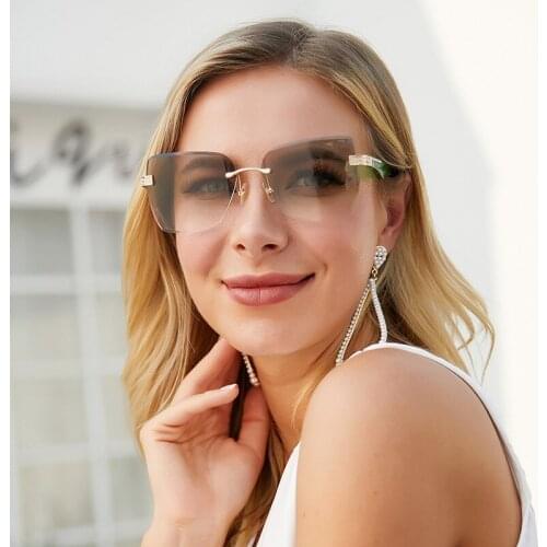 2021 new style sunglasses women frameless inlaid diamond imitation wood European and American trimmed sunglasses ladies glasses