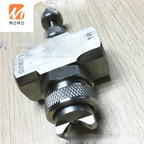 External mixing air atomizing spray nozzle