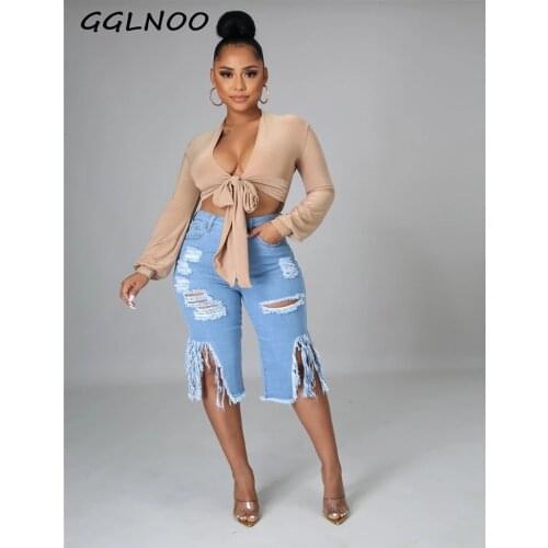 GGLNOO Fashion High Street Trousers Women Jeans Hole Ripped Tassle Low Waist Elastic Flare Knee Length Denim Pants