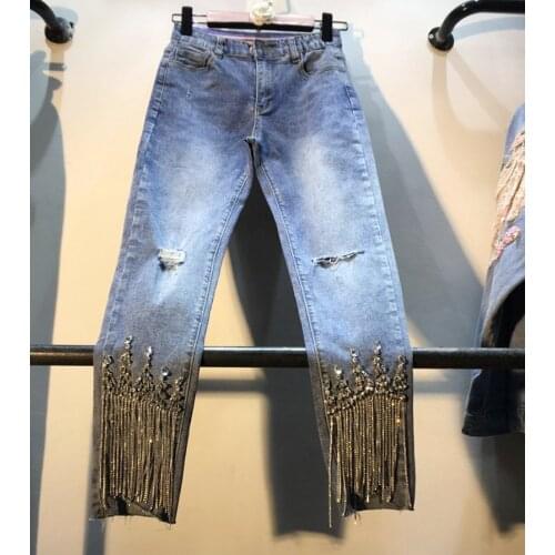 European station spring European new heavy industry diamond beaded tassel jeans female high waist was thin jeans F1221