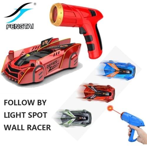 A zero-gravity remote control childrens racing rock climbing car toy that follows the laser
