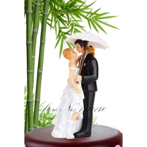 Romantic Umbrella Kiss In The Rain Wedding Cake Toppers couple bride and groom figurines