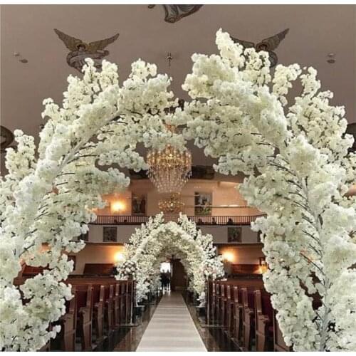 Tall white decorative cherry blossom trees for indoor wedding