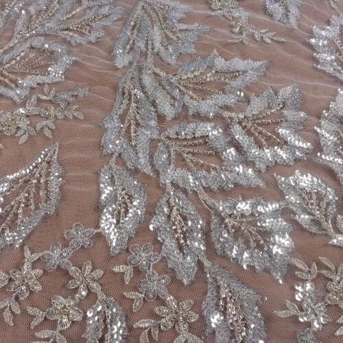 La Belleza new beaded sequins wedding dress lace fabric off white beads sequins lace fabric leaves pattern lace 1 yard