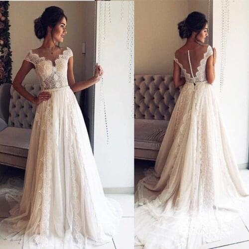 Boho Wedding Dresses 2020 Bohemian Wedding Gowns with Cap Sleeves V Neck Open Back Pleated Skirt Elegant A line Bridal Gowns