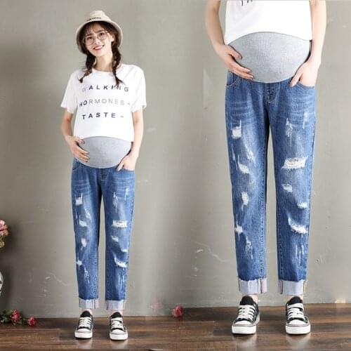 2019 spring and summer hole pregnant women jeans feet pants Korean version of the loose Harlan stomach abdomen pants