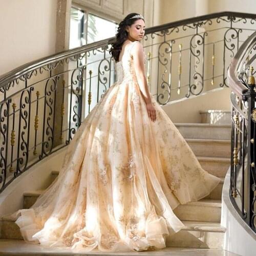 YiMinpwp Champagne Ball Gown Quinceanera Dresses V Neck Sweep Train Appliques Crystal Beads Formal Prom Party Gowns for Sweet 16