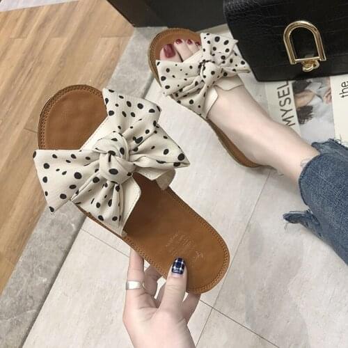 Bow tie wave point sandals for women 2021 summer new Korean version personality wear fairy flat bottom fashion word sandals