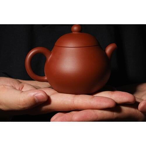 Yixing pear shaped purple clay teapot in Guanfu Museum