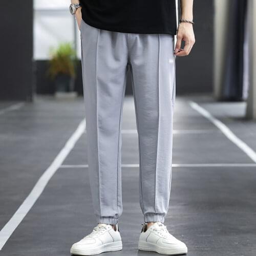 New fashion mens loose casual pocket pants 2021 hip-hop mens ice silk breathable jogging pants street mens plus size trousers