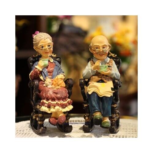 GRANDPA AND GRANDMA ROCKING CHAIR GRANDMOTHER PUT A WEDDING SOUVENIR ON THE TABLE DECORATIVE PIECES SCULPTURES ROOM