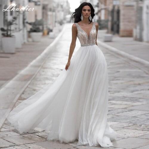 Lhuilier Sexy A Line V Neck Beaded Wedding Dresses 2021 Sleevelss Floor Length Backless Tulle Bridal Gowns Court Train
