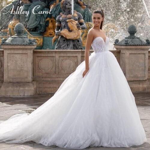 Ashley Carol A-Line Lace Wedding Dress 2021 Invisible Neckline Sexy Backless Button Beaded Sleeveles Bride Gown Vestido De Noiva